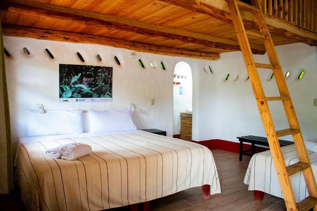 Postel nebo postele na pokoji v ubytování Cabañas Sierra Gorda