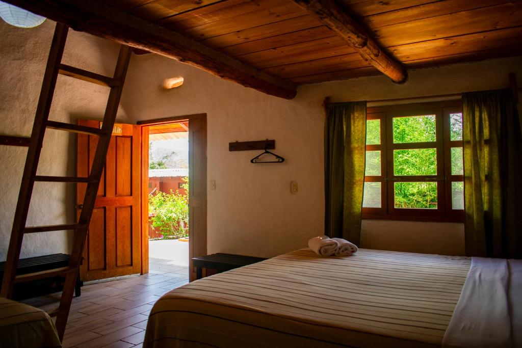 Postel nebo postele na pokoji v ubytování Cabañas Sierra Gorda