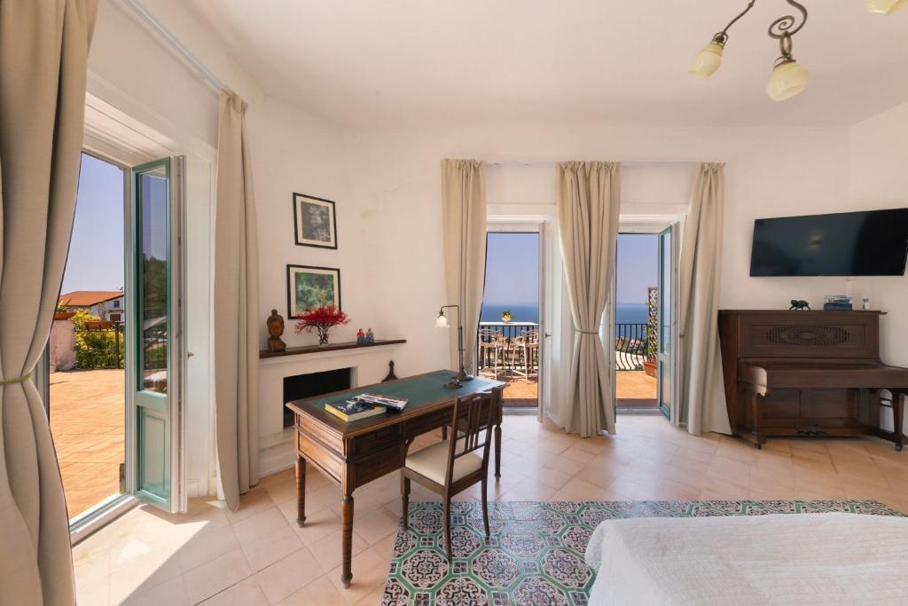 TV a/nebo společenská místnost v ubytování Villa Mundis Relais