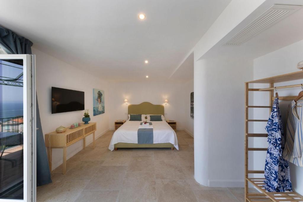Postel nebo postele na pokoji v ubytování Villa Mundis Relais