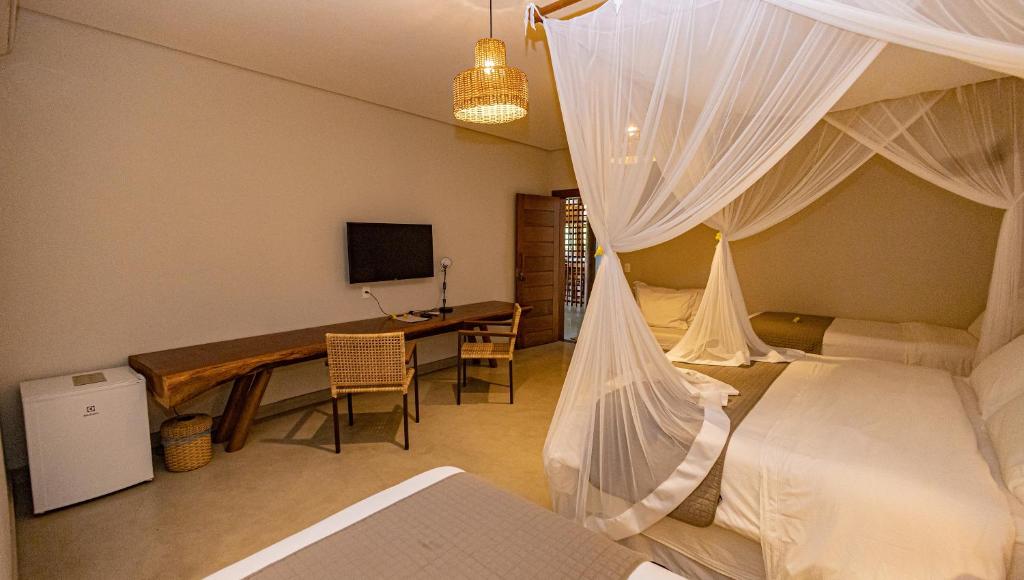 TV a/nebo společenská místnost v ubytování Aysú Trancoso Boutique Hotel