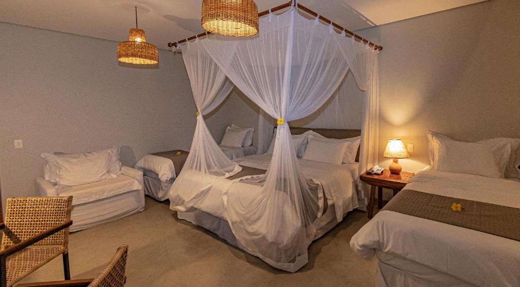 Postel nebo postele na pokoji v ubytování Aysú Trancoso Boutique Hotel
