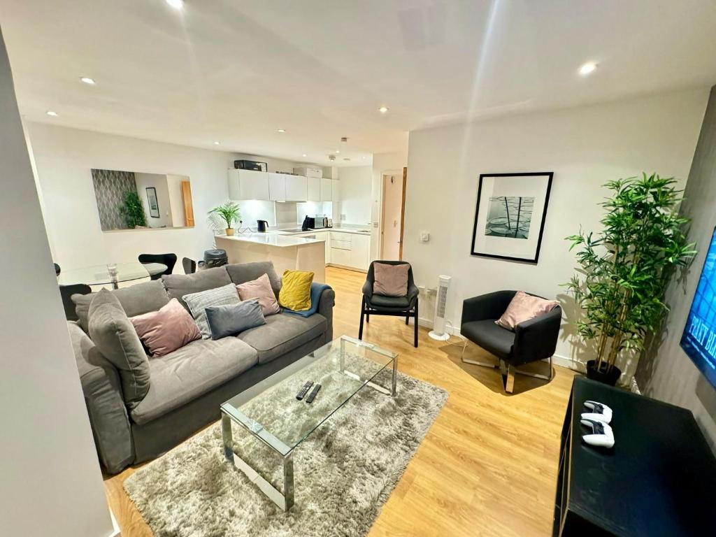 a living room with a couch and a table at London East Side Wharf in London