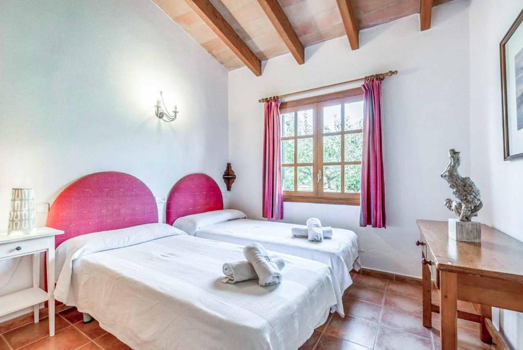 A bed or beds in a room at Maria Pollensa