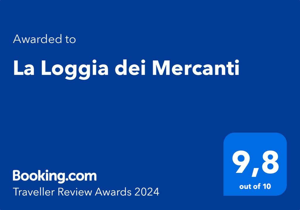 a blue screen with the text translated to la logica del mercament at La Loggia dei Mercanti in Cuneo