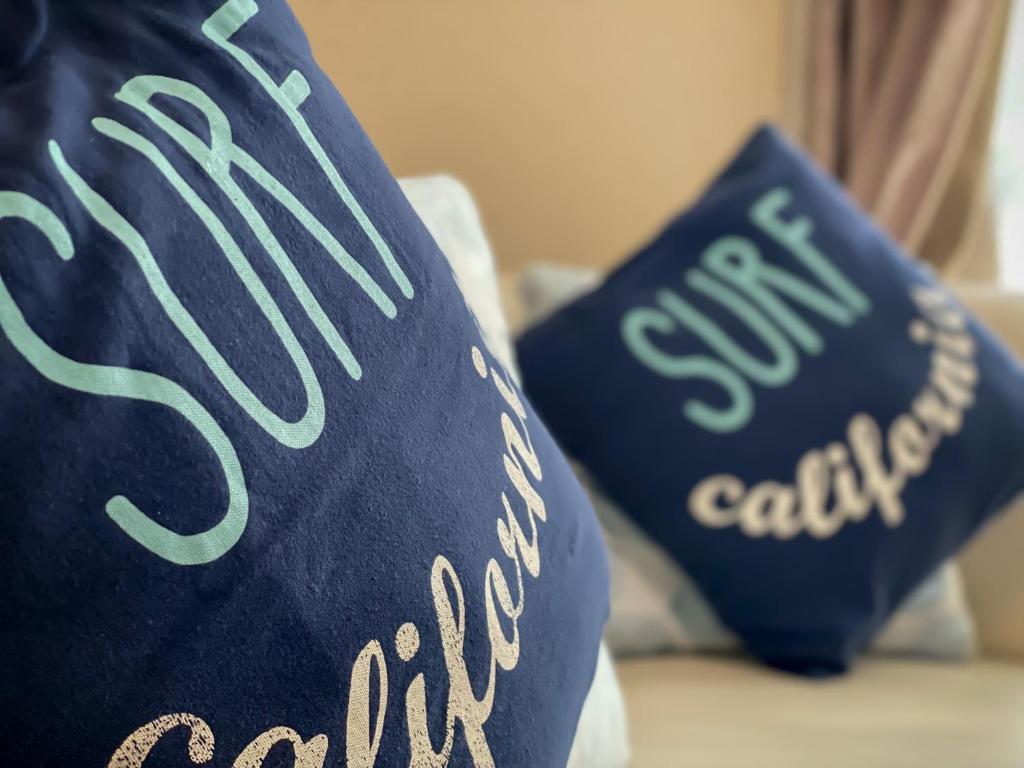 two pillows on a bed with the words stop car dealership at TSK Nanjyo - Vacation STAY 70147v in Sashiki