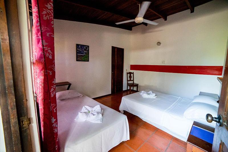 Postel nebo postele na pokoji v ubytování Hotel Hibiscus Cabina 4