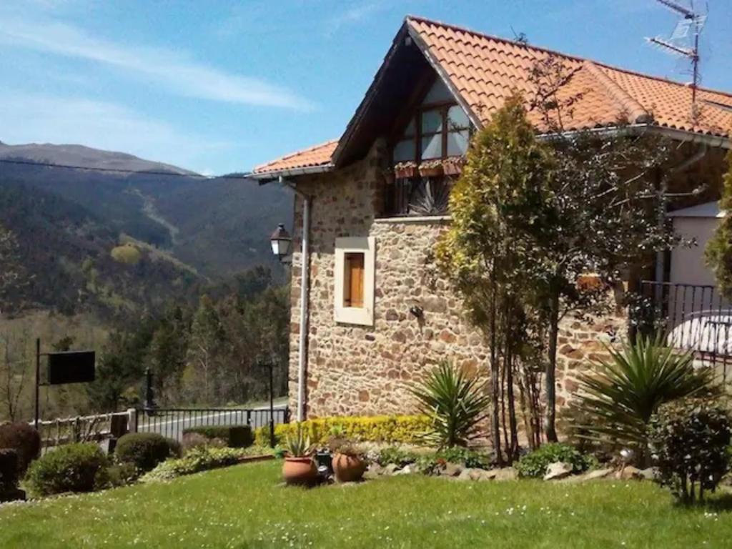 a stone house with a view at Urrezko Ametsa in Sopuerta