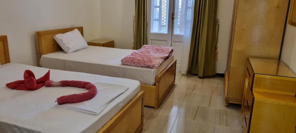Postel nebo postele na pokoji v ubytování DREAM ISLAND Hotel