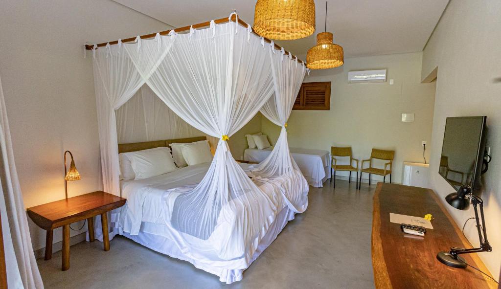 Postel nebo postele na pokoji v ubytování Aysú Trancoso Boutique Hotel