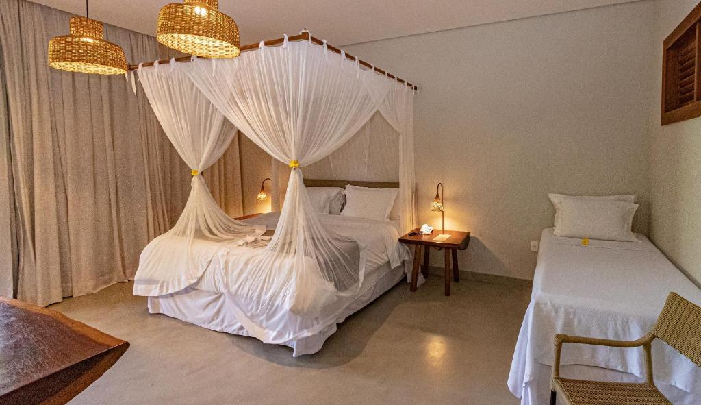 Postel nebo postele na pokoji v ubytování Aysú Trancoso Boutique Hotel