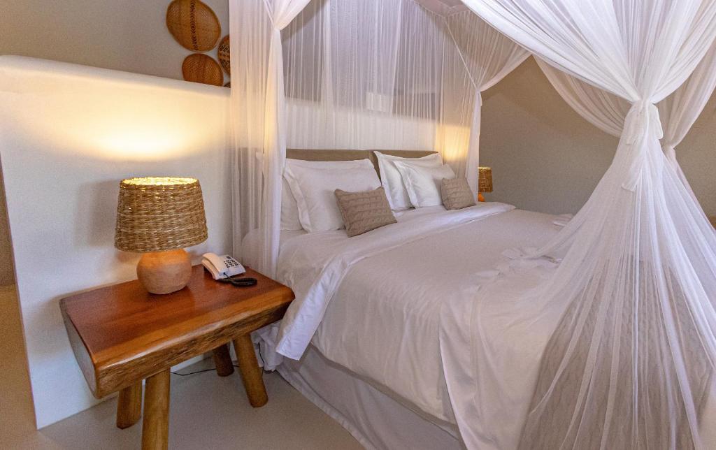 Postel nebo postele na pokoji v ubytování Aysú Trancoso Boutique Hotel