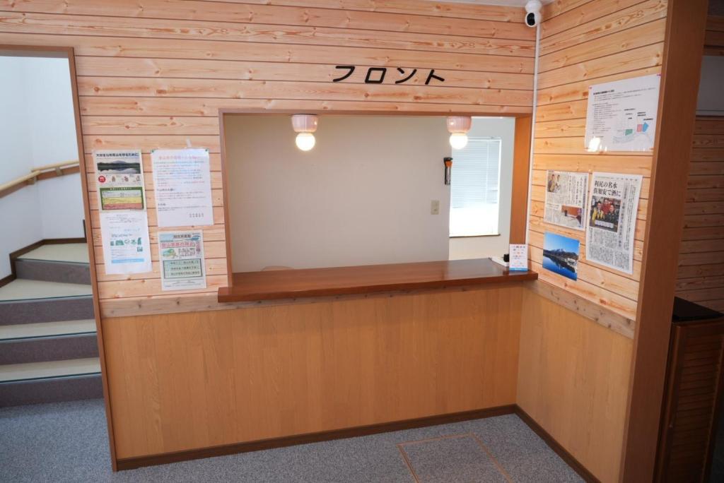 a room with a large door in a wooden wall at Shimano Yado Kamuirishiri - Vacation STAY 89700v in Oshidomari