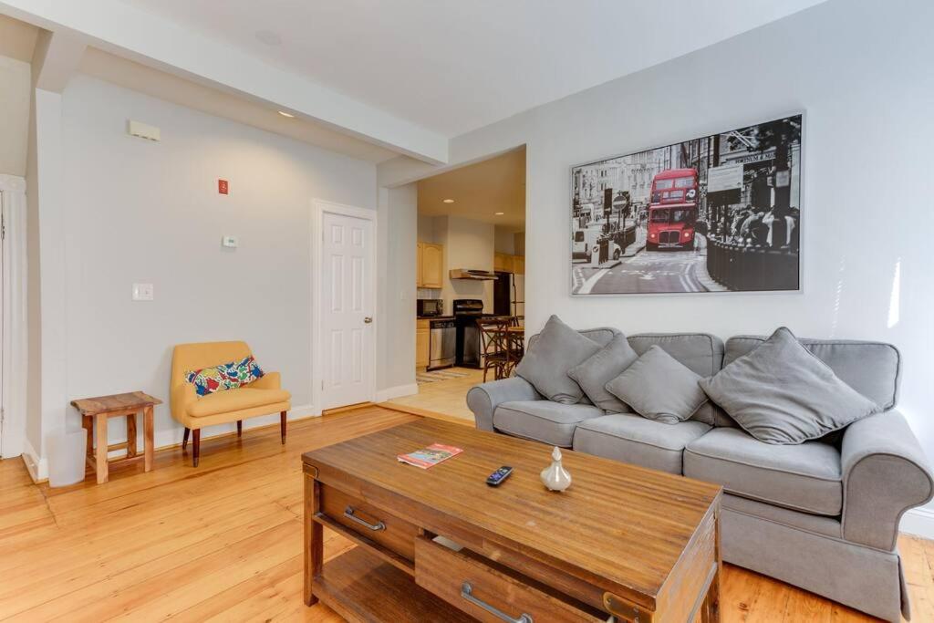 a living room with a couch and a coffee table at NEW! Boston Condo Near MBTA, 3Mi to Fenway! (U1) in Boston