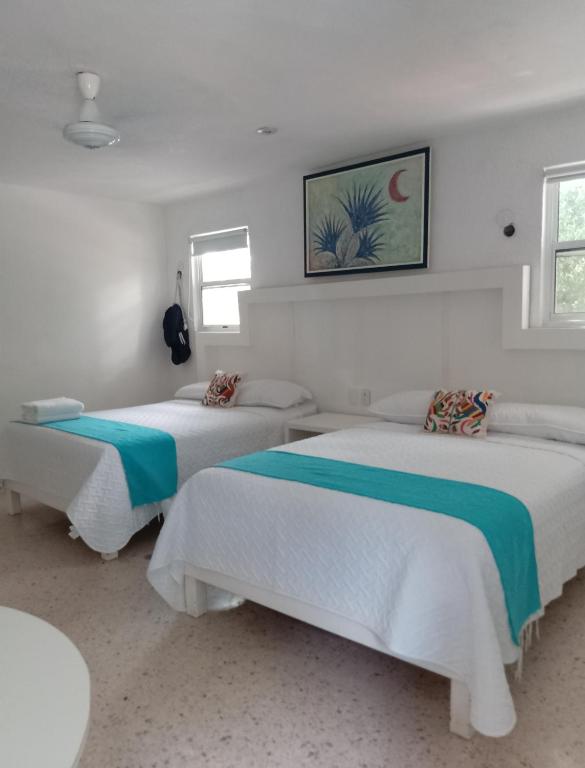 Postel nebo postele na pokoji v ubytování Hotel Downtown Merida