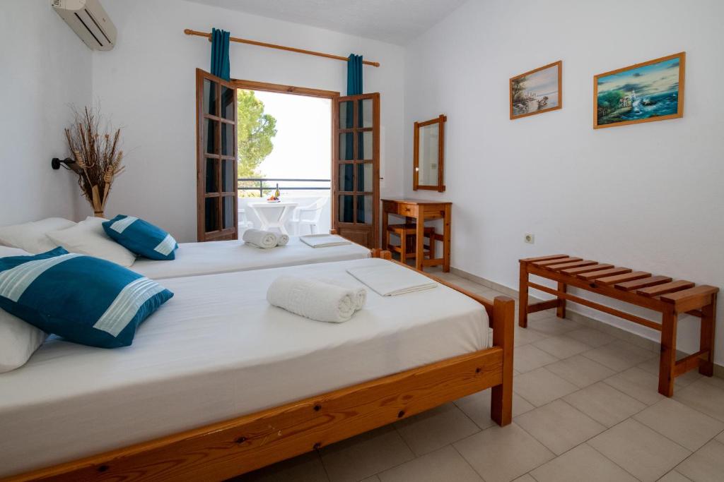 Postel nebo postele na pokoji v ubytování George Seaside Serviced Studios & Apartments