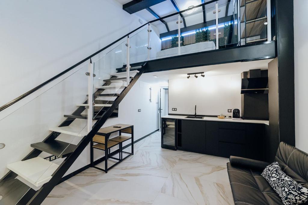 a staircase leading up to a kitchen in a house at HOSTAL LUXURY NIT I DIA in Altea