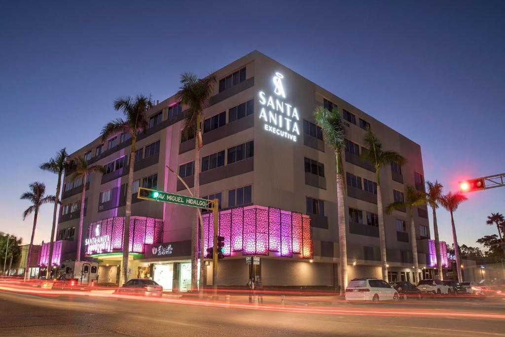 a building with purple lights on the side of it at Hotel Santa Anita a Balderrama Hotel Collection in Los Mochis