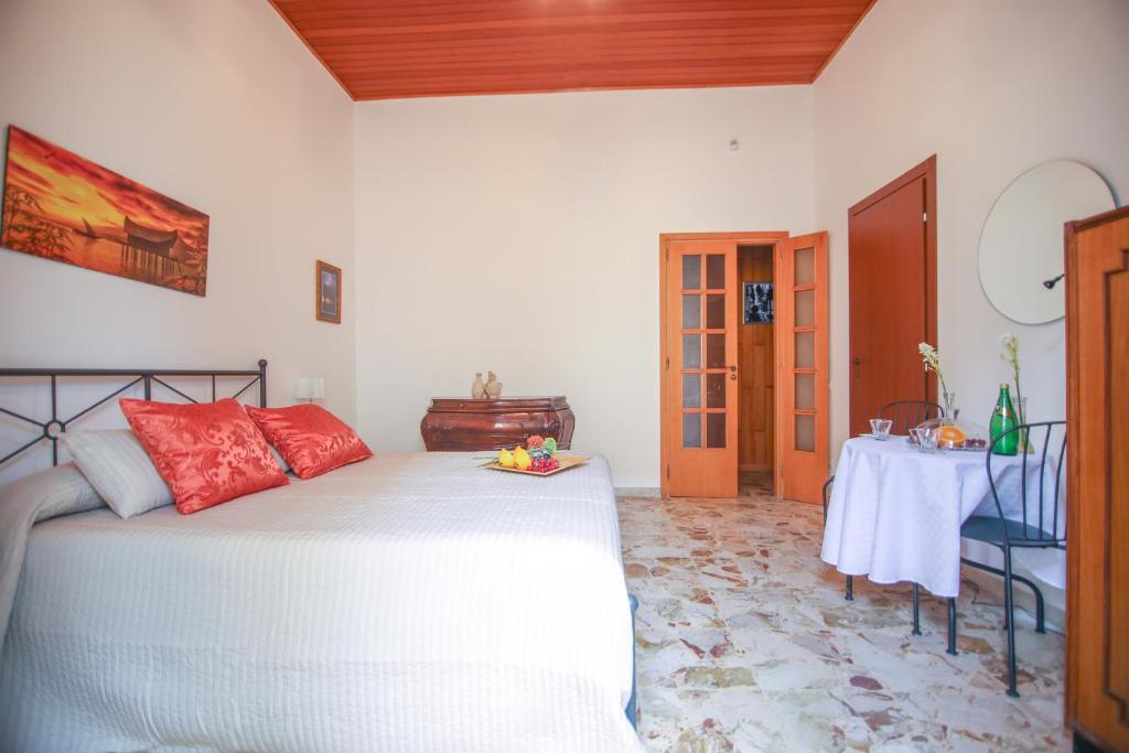 Postel nebo postele na pokoji v ubytování Soffio del Libeccio B&B
