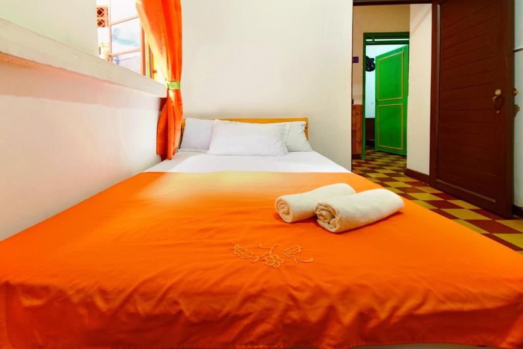Postel nebo postele na pokoji v ubytování Ding-Dong Hostel