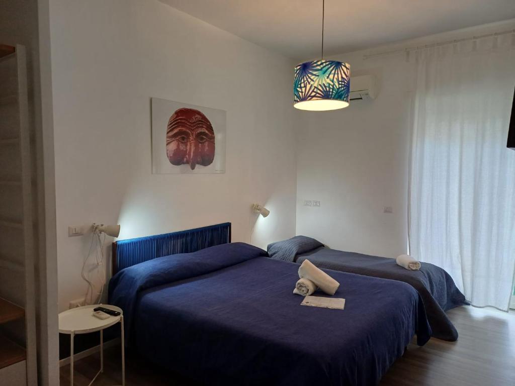 Posteľ alebo postele v izbe v ubytovaní Nonna Pina Art Rooms