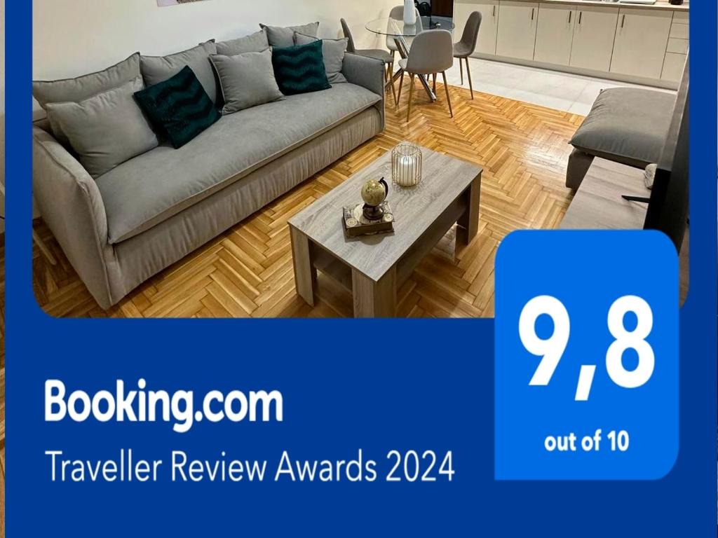 a living room with a couch and a table at Comfort inn in Athens