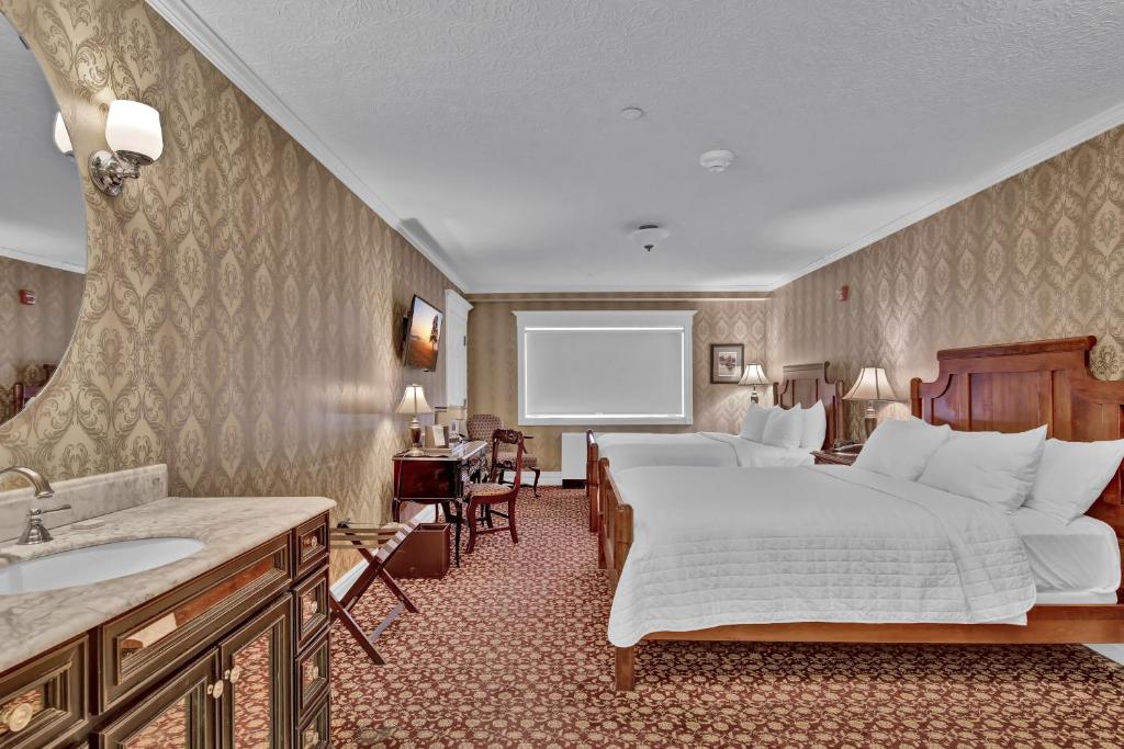 Postel nebo postele na pokoji v ubytování St James Hotel