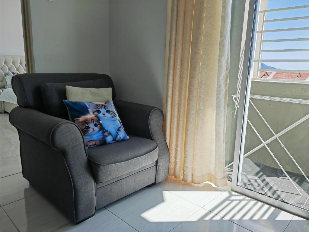Posezení v ubytování Homestay Pangsapuri Simfoni 3BR 7Pax Kuah Langkawi