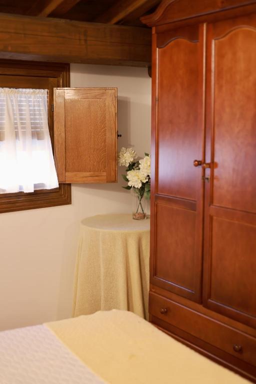 A bed or beds in a room at Casa rural La Aldea