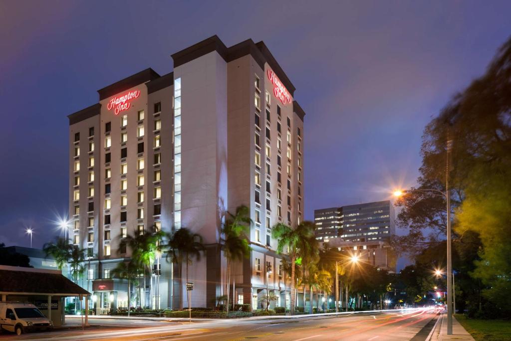 a lit up building on a city street at night at Hampton Inn Fort Lauderdale Downtown Las Olas Area in Fort Lauderdale