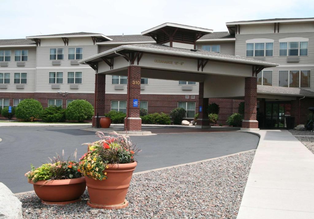 a building with two flower pots in front of it at Hampton Inn Duluth-Canal Park in Duluth