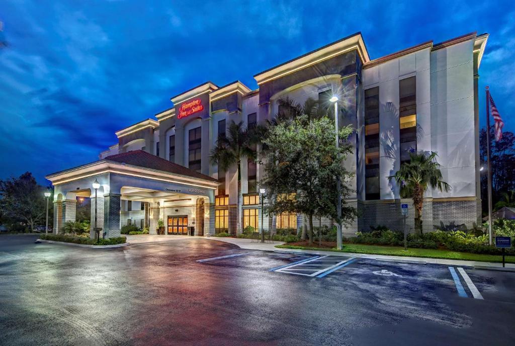 a rendering of a hotel with a parking lot at Hampton Inn & Suites Fort Myers Estero in Estero