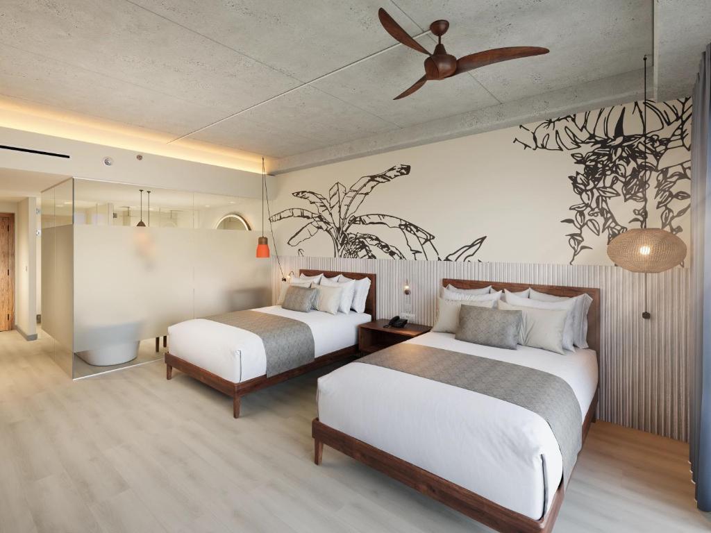 Postel nebo postele na pokoji v ubytování Hyatt Vivid Grand Island Cancun-All Inclusive Adults Only