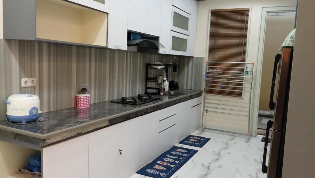 Kuchyň nebo kuchyňský kout v ubytování Azizah's Syariah Homestay
