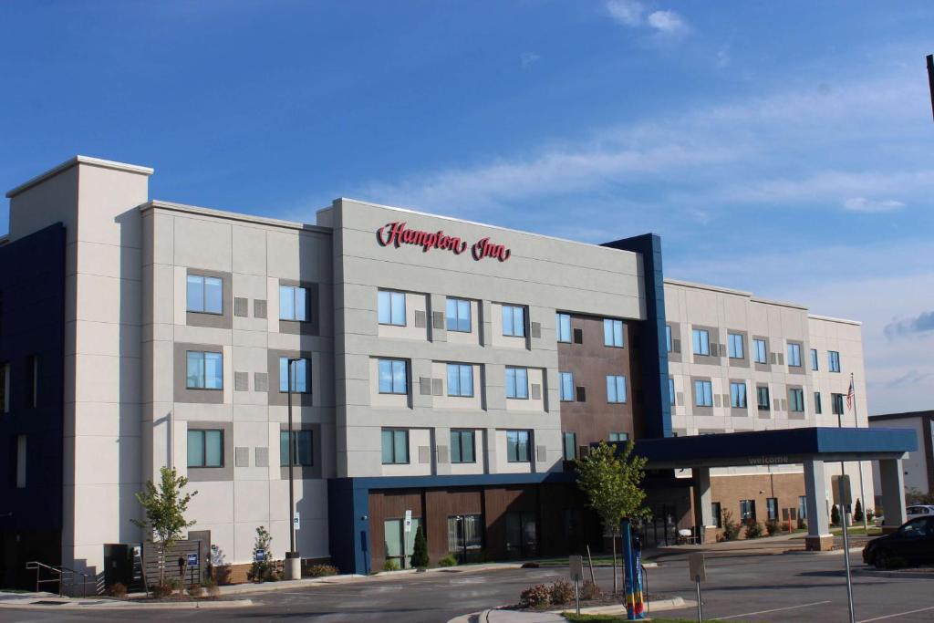 a large building with a sign on the side of it at Hampton Inn Lexington in Lexington