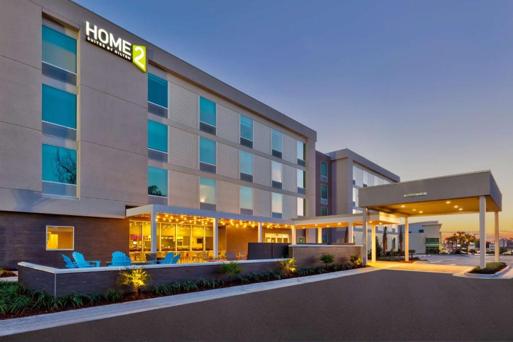 a rendering of a hotel building with a lobby at Home2 Suites Wilmington in Wilmington