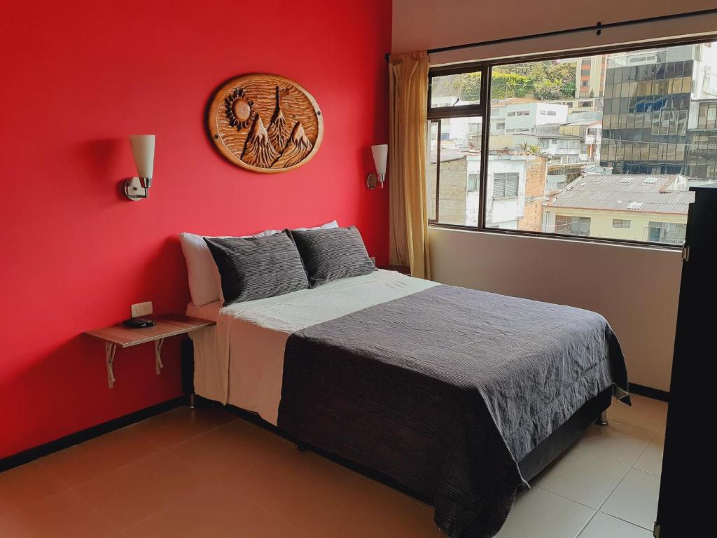 Postel nebo postele na pokoji v ubytování Ayenda Mountain Hostels Manizales