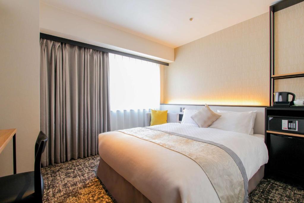 Llit o llits en una habitació de Best Western Plus Nagoya Sakae