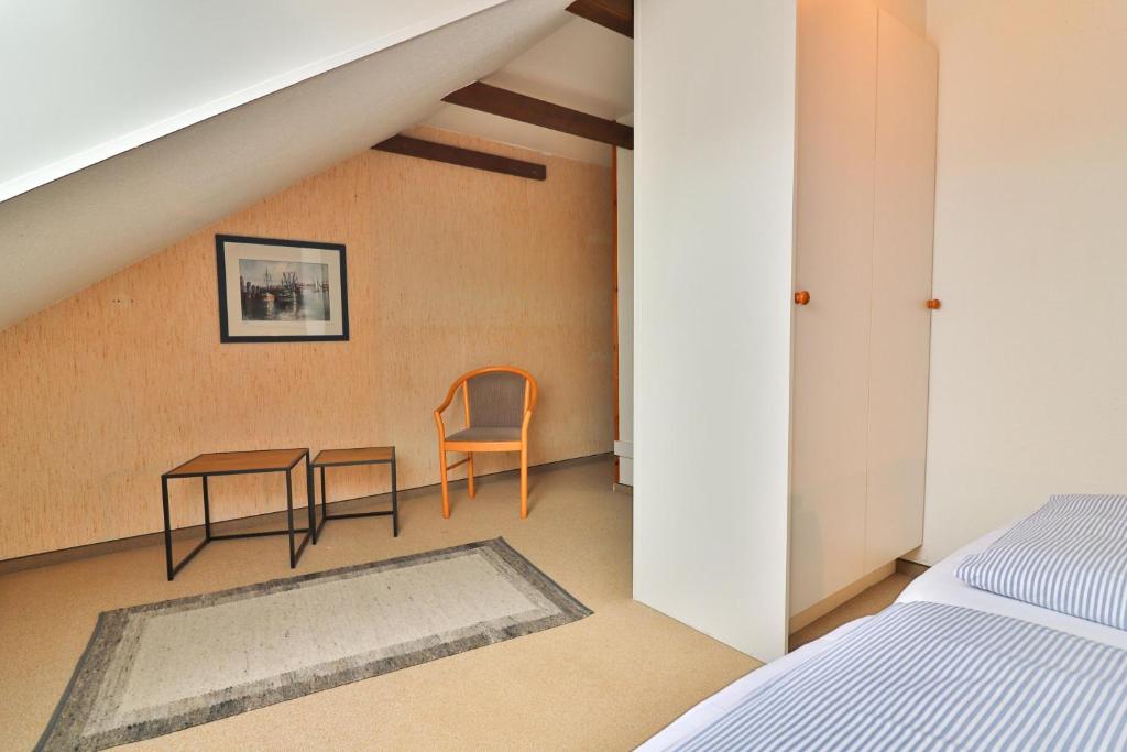 Postel nebo postele na pokoji v ubytování Seemannskojen Backbord