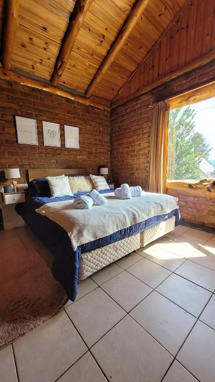 Ліжко або ліжка в номері Cabaña Bariloche
