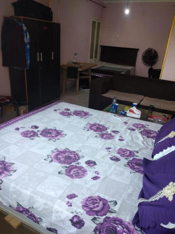 A bed or beds in a room at Pyramids Hotel