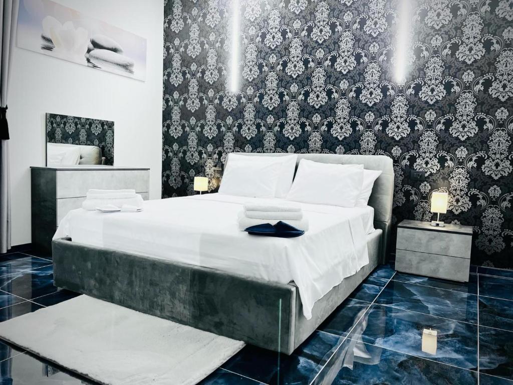 מיטה או מיטות בחדר ב-Seven Nights Bologna