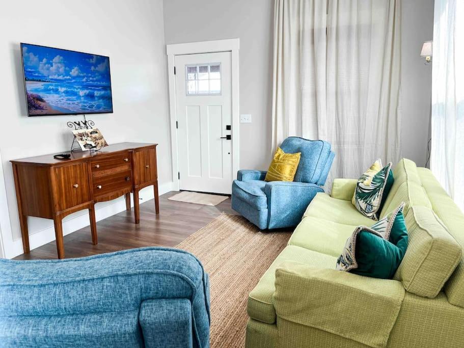 a living room with a couch and two chairs at Carmen’s Casita in Tampa