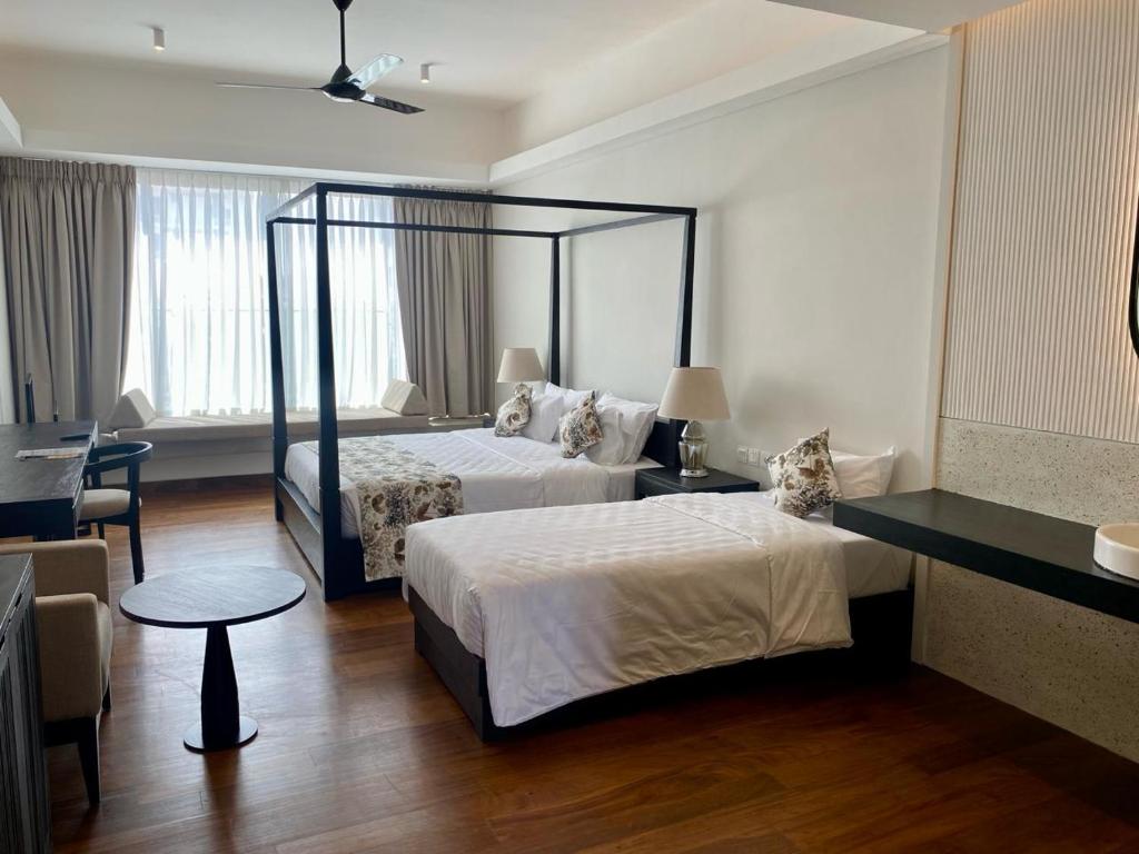Postel nebo postele na pokoji v ubytování Taprobane House