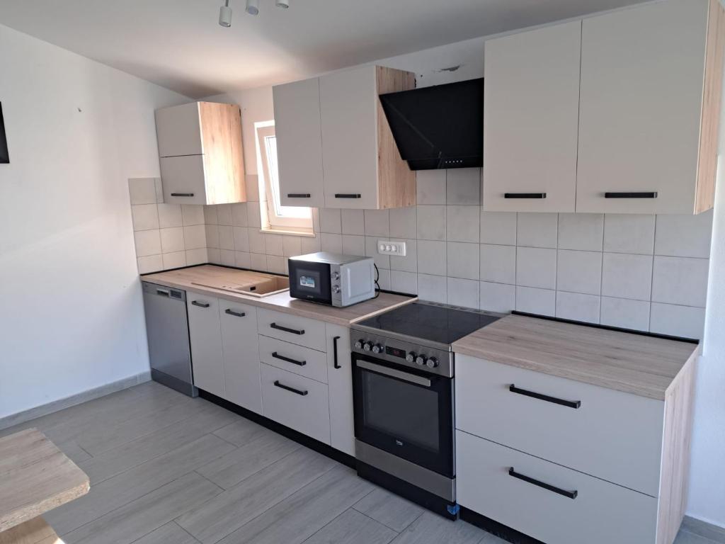 Kuchyň nebo kuchyňský kout v ubytování Apartman Magica