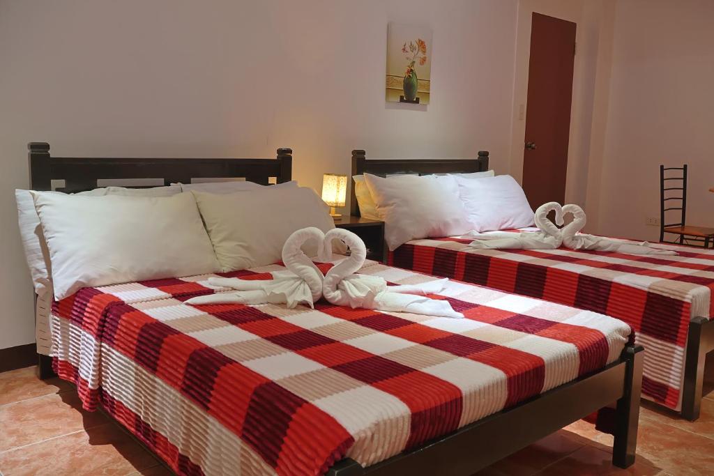 Postel nebo postele na pokoji v ubytování Point Vista Transient Accomodation