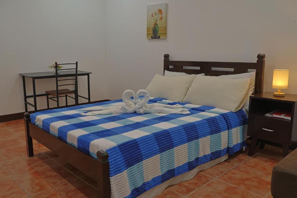 Postel nebo postele na pokoji v ubytování Point Vista Transient Accomodation