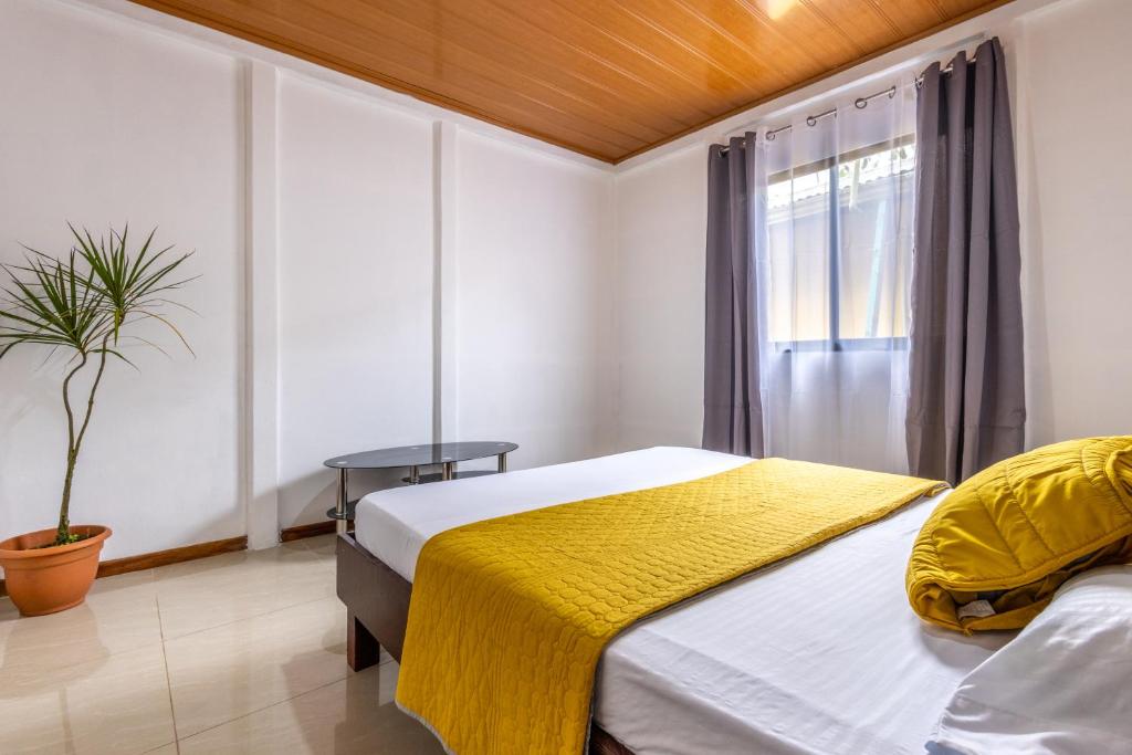 Кровать или кровати в номере Casa kattleya