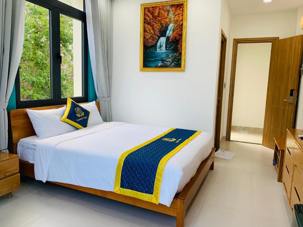 Postel nebo postele na pokoji v ubytování Golden Rose Hotel