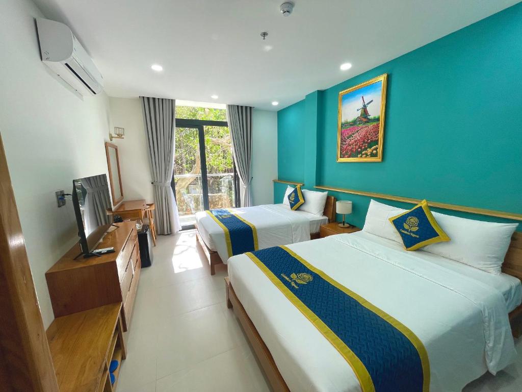 Postel nebo postele na pokoji v ubytování Golden Rose Hotel